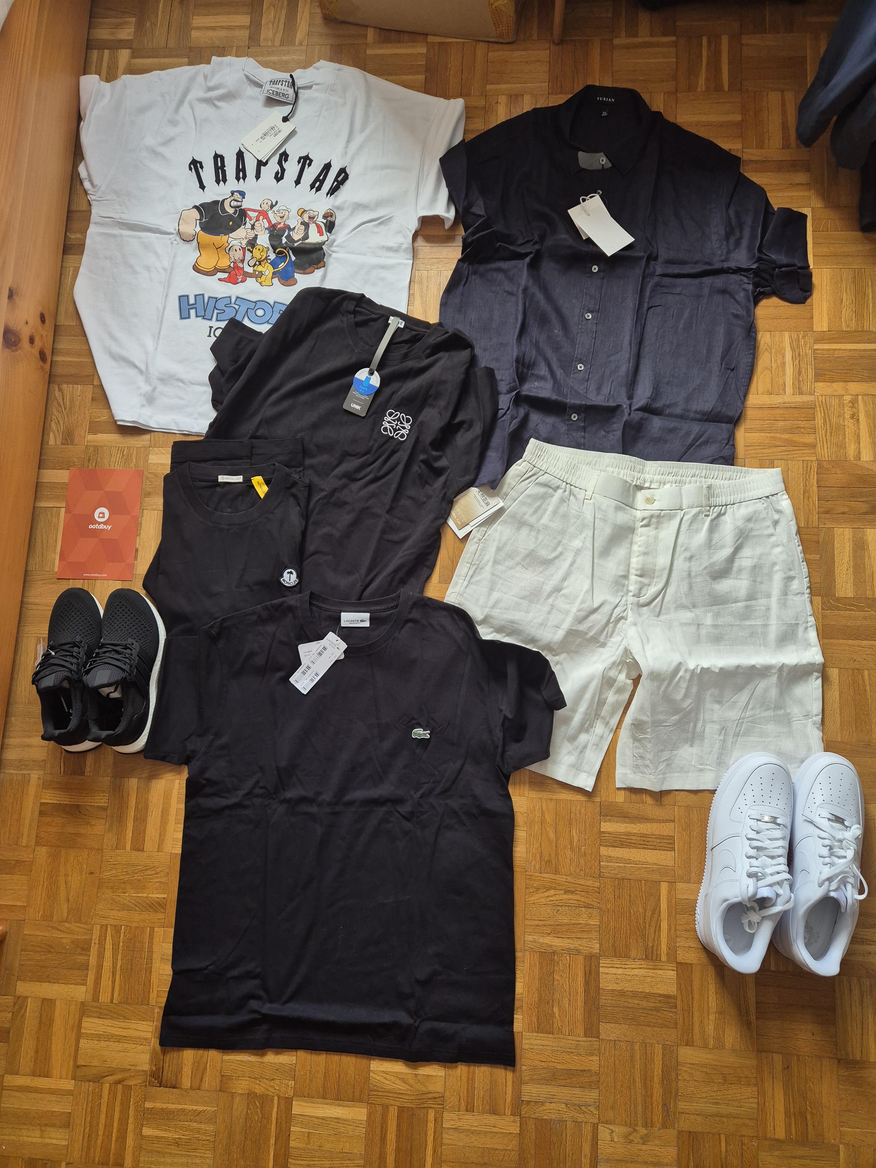 Clothing and shoes arranged on a floor in the Reddit author's 6.7 kilogram OOTDBuy haul